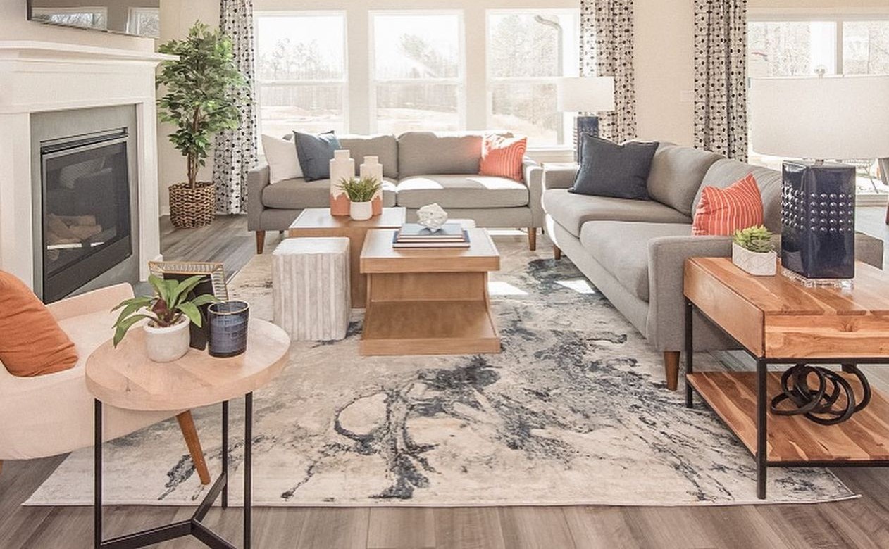 blue and rust colored area rug in bedroom with shiplap walls